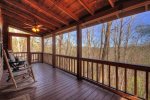 large screened in porch with scenic views
